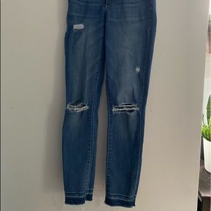 dark blue skinny jean, rips at knees